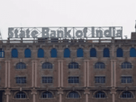 The image is depicting State Bank of India new cash withdrawal limit rules